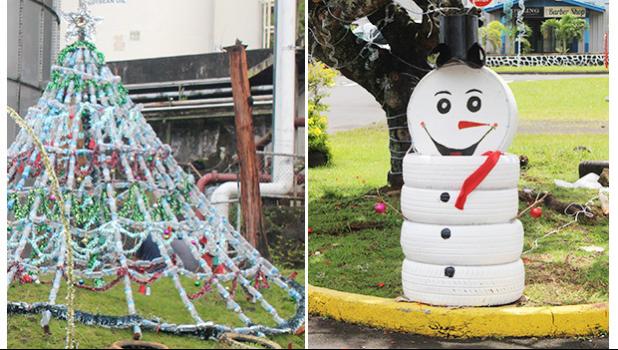 Christmas Tree made of plastic bottles and snowman from painted tires
