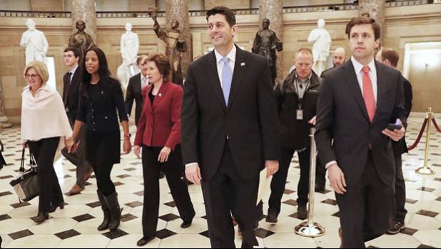 Paul Ryan of Wis., center, walks with other members of Congress to the House Chamber on Capitol Hill in Washington, Monday, Jan. 22, 2018, to begin a vote on a short term spending bill to reopen the government. (AP Photo/Pablo Martinez Monsivais)