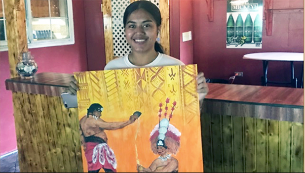 Katie Jewel Godinet with her artwork