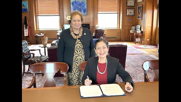 Congresswoman Uifa’atali Amata standing by Secretary Deb Haaland