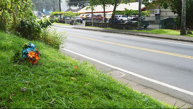 Flowers have been placed at the site where the late Lopesi Lameko was struck and killed by a vehicle earlier this year in June. Folasa Galea’i, who was the driver of the vehicle, has been charged by the government with vehicular homicide - a felony.    [photo: AF]