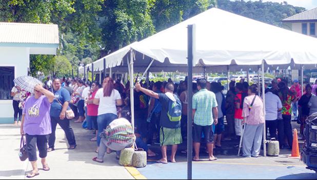 People crowded under the tents at Social Services in Utulei on Monday, April 20 for apparently Gita relief money.