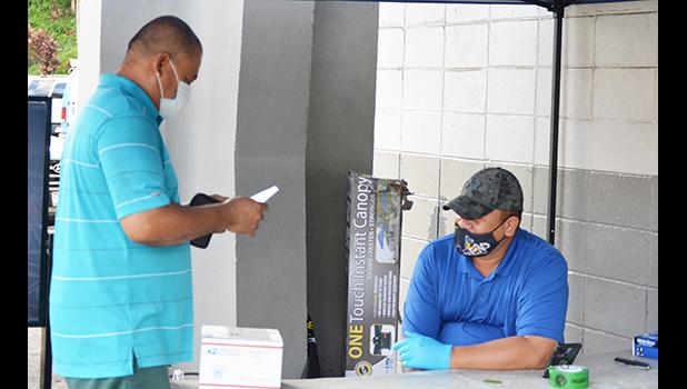 Customs agent inspecting a package of person picking up at post office