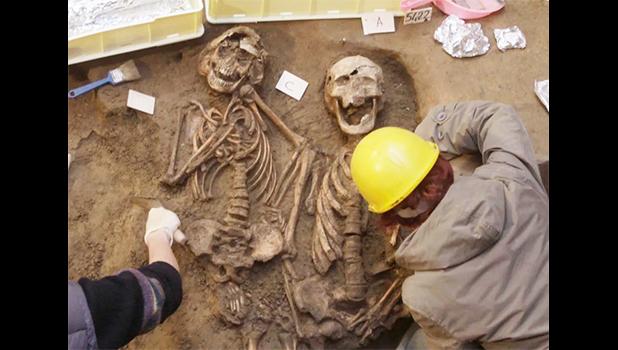 Dead men do tell tales through their physical remains. AP Photo/Francesco Bellini Two skeletons beind excavated