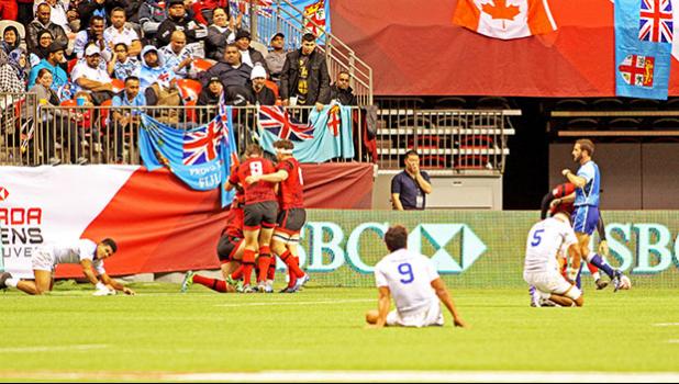 Manu Samoa players fall dejectedly after leading 14-0 in the first half, then failing to score in the second half, losing 21-14 to Wales in the Canada 7s, BC Place, Vancouver, Canada.  [Photo by Barry Markowitz]