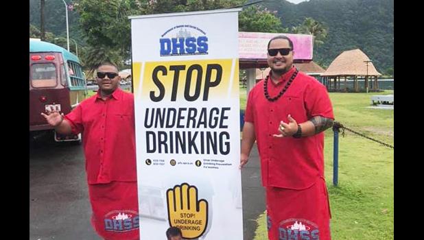 DHSS staff with prevent underage drinking sign