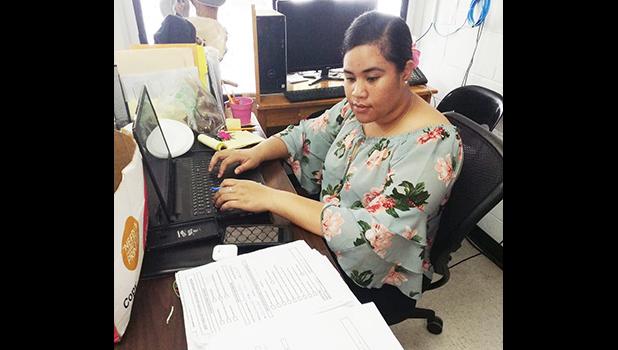 DMWR employee inputting data.