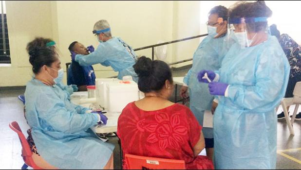 DoH staff at the Department of Youth and Women’s Affairs facility in Pago Pago conducting daily testing