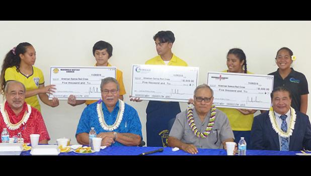 (Pictured l-r standing): Aitulagi Alofa, Gabriel Mendoza, Ben Schuster, Racquel Mamea, and Georgina Alofa, (l-r sitting): Vaito'a Hans Langkilde, Filifaatali Mike Fuiava, Governor Lolo Matalasi Moliga, and Pastor Lemmy Seumanu.