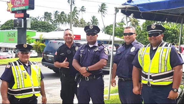 DPS officers pose for the Samoa News camera during the 2018 holiday enforcement.