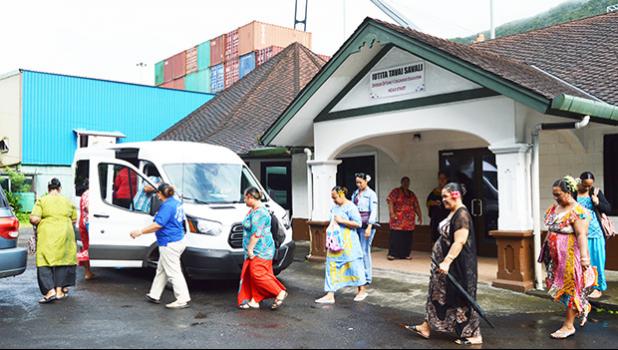 ECE teachers walking toward a van to go to the residence of the ECE Director in Vaitogi
