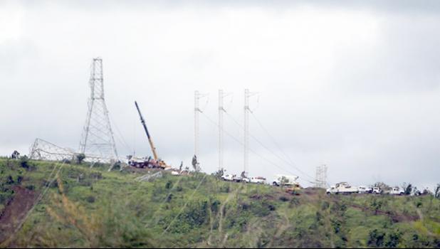  Workers restore high tension power lines damaged by Hurricane Maria in Guayama, Puerto Rico. [Photo: AFP via RNZI] 