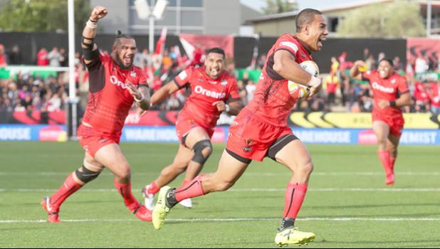 Team mates celebrate as Tonga's William Hopoate scores [Photo: Photosport vis RNZI] 