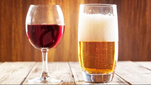 Red wine glass and glass of light beer