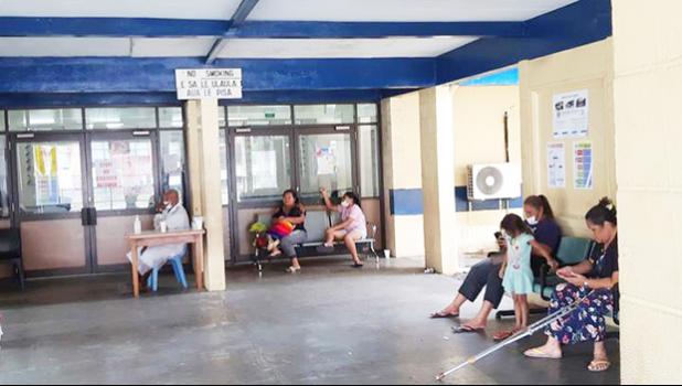 Mothers and children waiting at a hospital in Apia. 