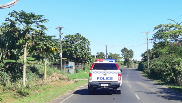 A Samoa police vehicle patrolling the highway