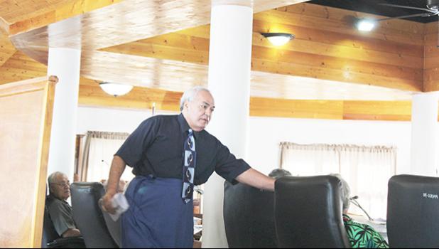 Chief Election Officer, Dr. Lealofi Uiagalelei shaking hands with lawmakers.