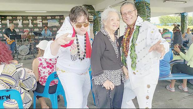 Mrs. Vera Annesley (center) and two of the several Elvis impersonators that were hosts at the event —(left) Joey Cummings of KHJ Radio and (right) Tui Letuli, a board member of both SMF and SJAAS