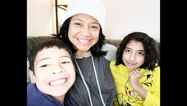 Epifania Rapozo (middle) and her two children