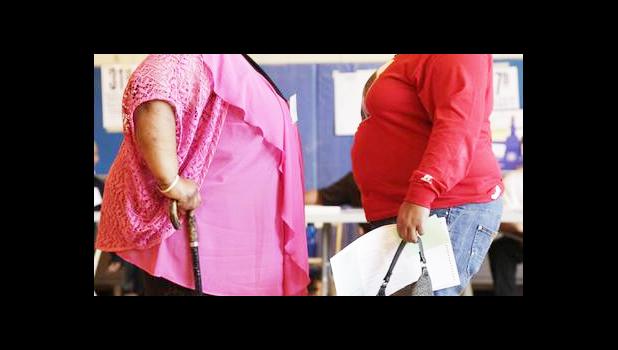 In this June 26, 2012, file photo, two women converse in New York. "Socially accepted normal body weight is shifting toward heavier weight. As more people around us are getting heavier, we simply believe we are fine, and no need to do anything with it," said Dr. Jian Zhang, a public health researcher at Georgia Southern University and the lead author in a study released on Tuesday, March 7, 2017. (AP Photo/Mark Lennihan, File) In this June 26, 2012, file photo, two women converse in New York. "Socially accepted normal body weight is shifting toward heavier weight. As more people around us are getting heavier, we simply believe we are fine, and no need to do anything with it," said Dr. Jian Zhang, a public health researcher at Georgia Southern University and the lead author in a study released on Tuesday, March 7, 2017. (AP Photo/Mark Lennihan, File)