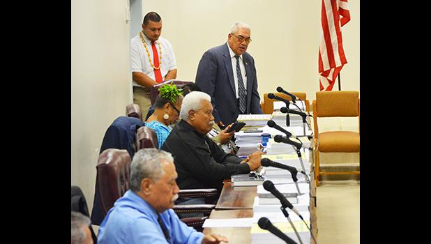 Four representatives at their desks