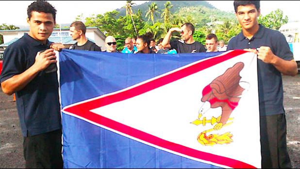 Two local fighters representing American Samoa during the 2018 Oceania Youth Boxing Championships, which was also a Qualifier Championship for the Youth Olympics Games in Argentina this year, Falaniko Tauta and Jolando Taalo, posing with the American Samoa flag.