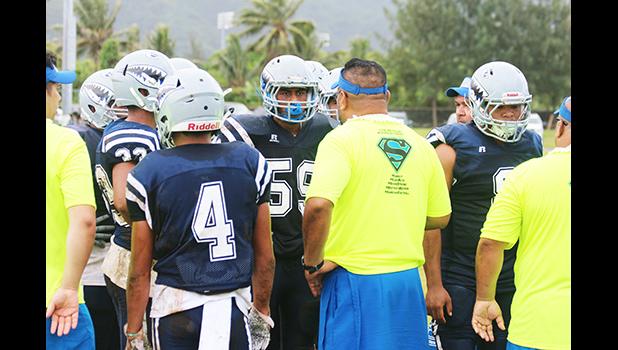 Samoana Sharks head coach, Pati Pati giving advice to his defensive unit 