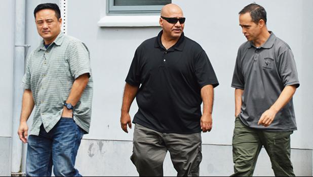 Three federal agents outside of the District Court