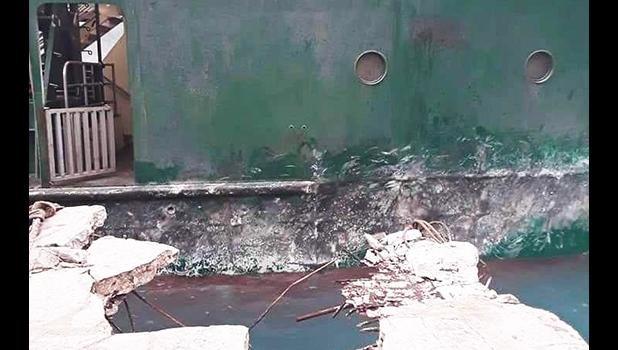 The damaged wharf at Ofu with ferry in background