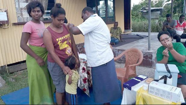 Woman receives a measles vaccination in Fiji
