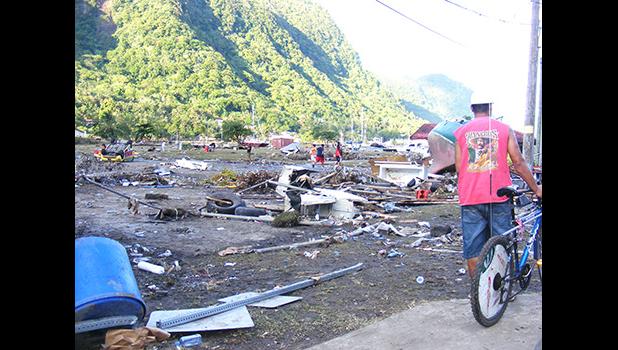 Residents at Pago Pago Park amid debris