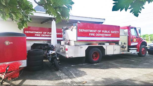 Two firetrucks awaiting parts