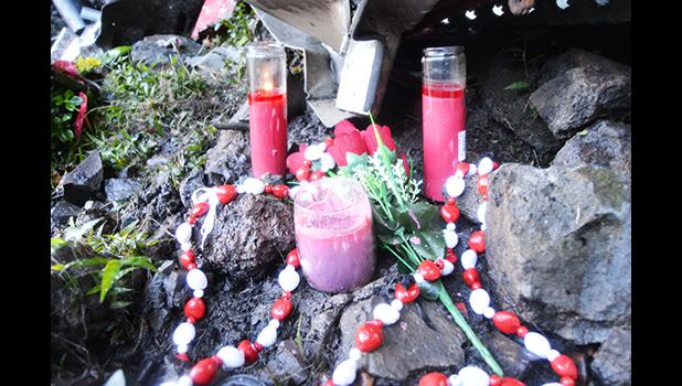 Flowers and candles were placed at the scene where two firefighters were killed