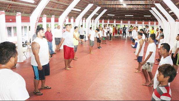 The Fetu Ole Afiafi fautasi crew warming up with stretches and other numerous strategies at the Fano Guest House in Faga’alu yesterday evening – part of their preparations for the upcoming Flag Day Fautasi Race, which is scheduled to sound off next week Friday. [photo: TG]  IMG_8846