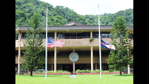 Flags at half staff in front of EOB