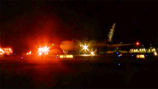 Aircraft on runway at HNL at night during emergency landing