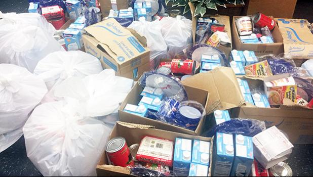 Bags and boxes of food items were distributed Thursday to employees of the Satala can plant, Talofa Systems American Samoa Inc., thanks to the generosity of Panamex and nonprofit organization God Restores and Saves Precious People (GRASPP).  [photo courtesy] 