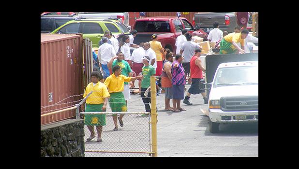 Head football coaches from all the high school football teams on island, as well as some of their players bombarded the Port of Pago Pago last week Monday afternoon in the effort to collect their donated football gear from the University of Michigan’s Tony Tuioti, Head Coach Jim Harbaugh, along with the family of Wolverines Football Team at U of M.  [photo: THA]
