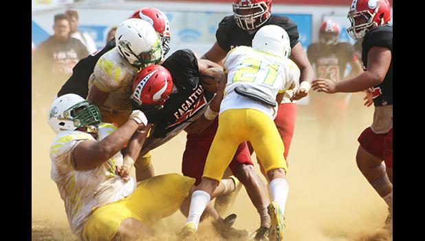 Leone Lions’ beastly defensive lineman Cyan Fiatoa and his teammates bringing down Joseph Umu