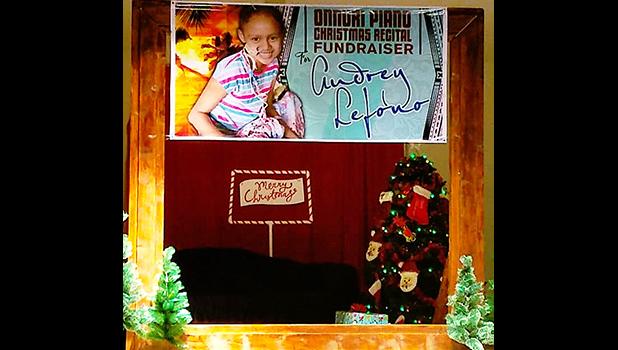 A banner with the photo of 10-year-old Audrey Lefono