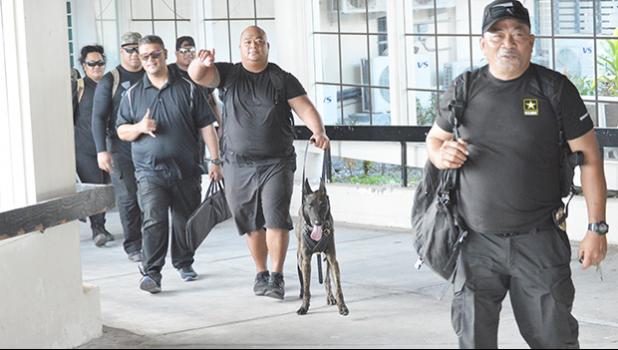 detectives of the DPS Vice & Narcotics / K-9 Units at the Pago Pago International Airport 