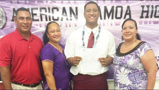 Frederick Mauigoa with family members after signing with Washington State