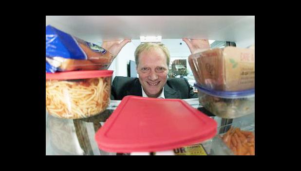 In this Tuesday, Dec. 6, 2016 photo, Brian Wansink, a food behavior scientist at Cornell University, poses for a photo in a food lab at the university in Ithaca, N.Y. Wansink says even though it shortens shelf life, move fruits and vegetables out of crisper drawers and put them at eye level. (AP Photo/Mike Groll)