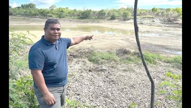 Mayor Jeff Adalbai looks at the water level 