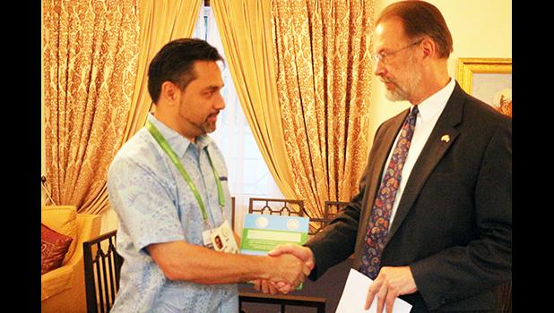 US Ambassador Allen Mustard presenting ASNOC General Secretary Ethan Lake with a welcoming Gift for team American Samoa during the Ambassadors Cocktail Reception in honor of the American Samoa Delegation to Ashgabat, Turkmenistan for the 5th AIGMA games.   (Photo:Team American Samoa)