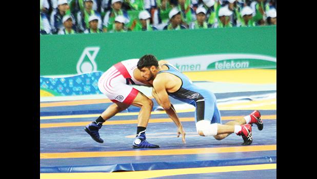 Daniel Misaalefua in his Bronze Medal Match (Photo: Terry Custodio Auva'a)