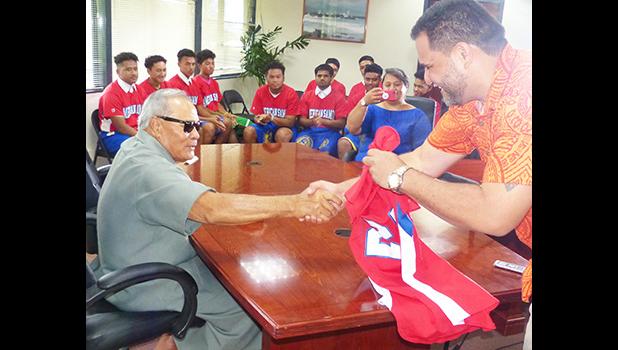American Samoa Baseball Association president, Marcus Langkilde presented Gov. Lolo Matalasi Moliga with team jersey.