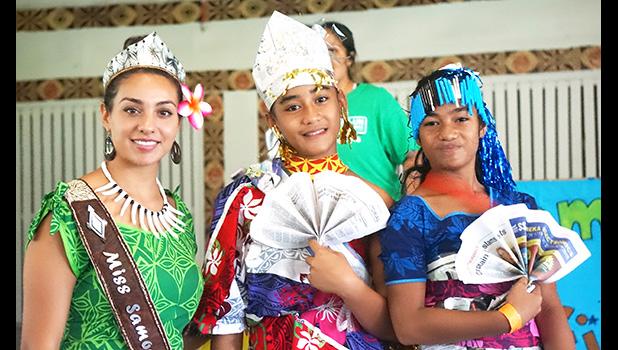 GLOW girls wearing their recycled outfits with 2018 Miss Samoa