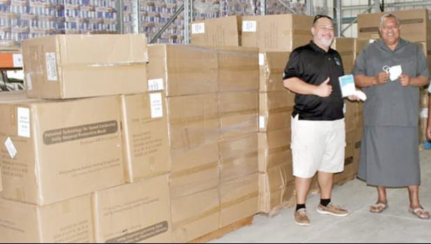 Gov. Lemanu Peleti Palepoi Sialega Mauga with Ziggy Vollrath and cartons of PPE