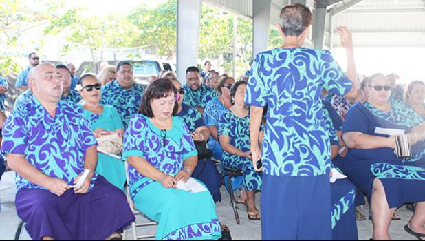 Public school principals, vice principals, administrators and officials singing a hymn